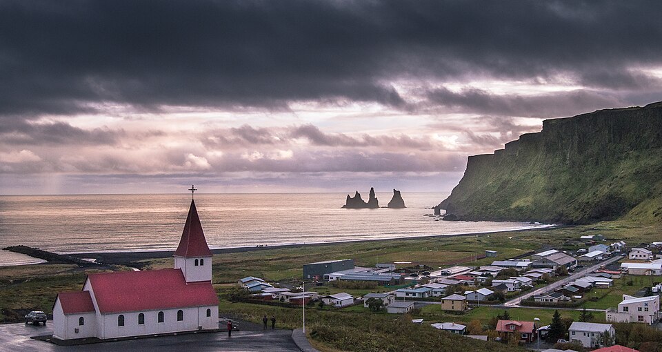 Vík village and church in a historical photograph from 2017.
